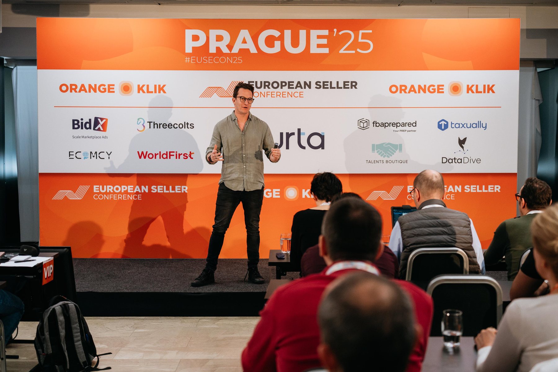 Yoni Kozminski speaking on stage at European Seller Conference