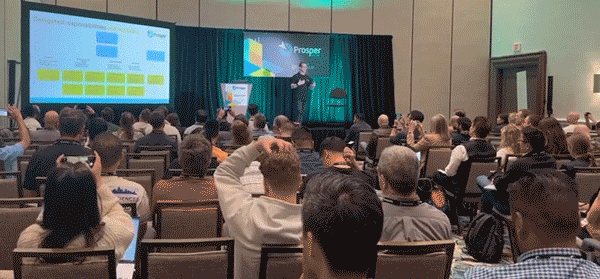 Yoni Kozminski speaking at Prosper Show 2024